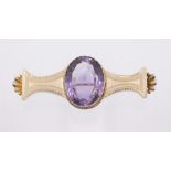 A Victorian amethyst and gold brooch, set to the centre with an oval amethyst, approx 25 x 20mm,