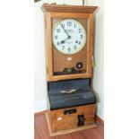 A good National Time Recorder Ltd industrial time recorder/ clocking in clock in oak case, 14" x 35"