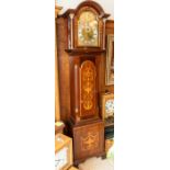 A late Victorian or early Edwardian longcase clock with three-train movement chiming on tubes.