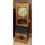 A National Time Recorder industrial wall-mounted time recorder/ clocking-in clock in an oak case,