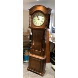 W Walters of Ashbourne 8 day longcase clock with round dial contain in a oak case with turned