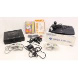 Sega: An unboxed Sega Saturn console, together with two controllers and cables, a boxed Sega