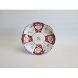 A Japanese Imari Foliate Dish. Meiji period. The interior decorated with painted with radiating
