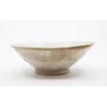 A Qingbai Type Bowl. Possibly Song Dynasty, the rounded sides rising from a short foot to a flared