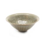 A Northern Song Dynasty Yaozhou moulded bowl, with steep sloping sides rising from a short foot to