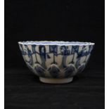 A Qing Dynasty Kangxi period moulded blue and white Bowl, painted in under glaze blue with Long