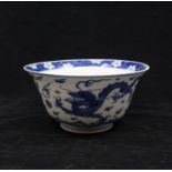 A Kangxi Period, Blue and White deep ‘Dragon and Carp’ bowl. The rounded sides rising from a