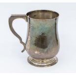 An Arts & Crafts silver planished baluster mug, hallmarked Haseler Brothers, Chester, 1913, 5.58 ozt