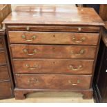 A George III chest of four drawers in mahogany on bracket feet, with brass swing handles and top