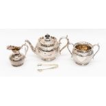 An early 20th Century electro plated three part tea service, with honeycomb design in an ornate