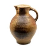 Nic Collins (b1958) salt glaze stoneware jug. Height approx 30cm. Incised signature to the base.