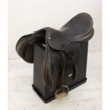 A second-hand brown leather saddle