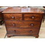 An early 19th Century mahogany chest of two above two drawers with knob handles on bracket feet