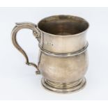 A George V silver baluster shaped Christening cup, S-scroll handle, engraved inscription dated 1929,