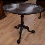 A Georgian style oval supper tilt top table, case on tripod stand