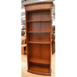 A tall reproduction mahogany five-shelf bookcase with Adam-style inlaid top