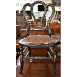 A 19th Century childrens chair, inlaid, with rush seat, 62cms high approx