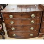 A late 18th Century bow-fronted chest of four drawers with brass swing handles, no feet