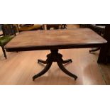 A George IV rectangular tilt top breakfast table with lions' feet legs and castors