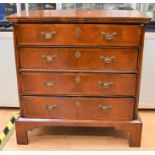A George III veneered chest of four drawers on bracket feet with brass swing-handles (not original