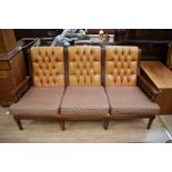 A Chesterfield style three piece wooden-framed suite, button back in mustard leather/leatherette - a