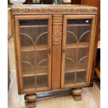 Two 1030s display cabinets, one oak and the other mahogany with glass side shelves