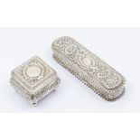 A Victorian silver casket shaped ring box, bombe body on four ball feet, the hinged cover with