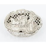 An Edwardian silver shaped oval dressing table / pot pourri shaped oval box, the cover chased and