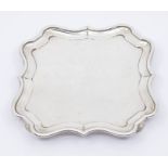 An Edwardian silver quatrefoil shaped salver, raised border, on four bracket feet, hallmarked by