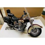A franklin mint Harley Davidson motorcycle model, complete with display case