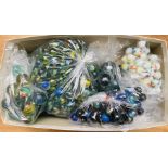 A mixed assortment of marbles, all organised into bags according to size and pattern (qty)