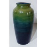 A Moorcroft vase in shades of green. Condition Report: 9cm crack running down from top edge Chips