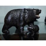 A Black Forest carved group of a bear and cub, the bear with glass eyes, 20cm long condition: some