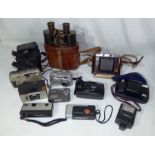 Collection of cameras and a pair of binoculars