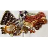 A selection of jewellery to include amber, hardstone, coral bone and other necklaces; a