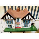 *****RE-OFFER £20 - £30*******  A 20th Century wooden dolls house, featuring hand painted detail,