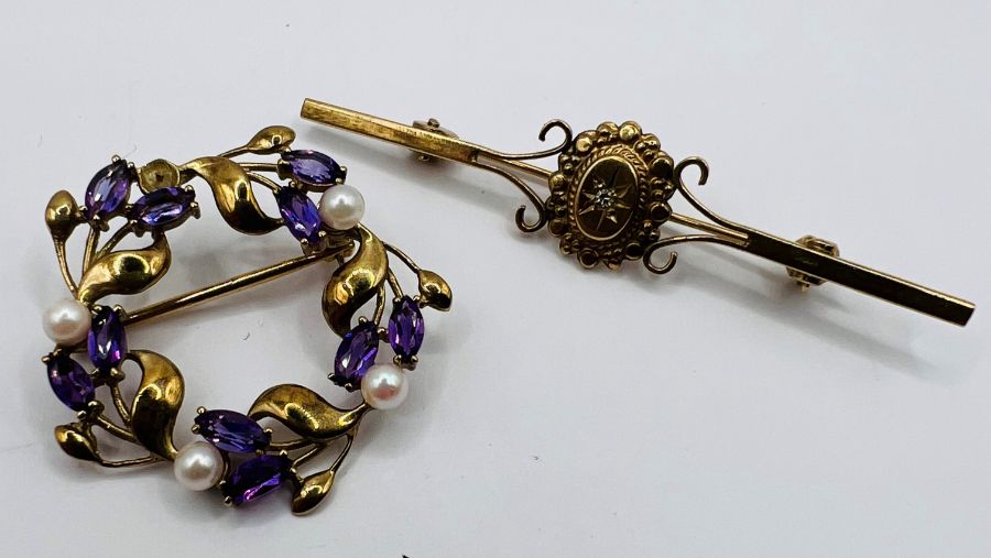 A pair of 9ct gold brooches, both hallmarked for birmingham: an Amethyst and seed pearl wreath