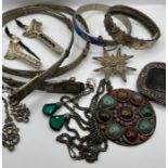 A selection of ten items of white metal jewellery from the Middle East, Thailand, India and the