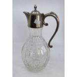 A glass claret jug with silver plated mounts 31.5cm high good condition