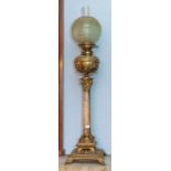 A decorative Victorian brass and alabaster table oil lamp, with classical column, green tinted