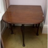 A mahogany drop leaf small dining table in Georgian style, rounded rectangular, on cabriole legs,