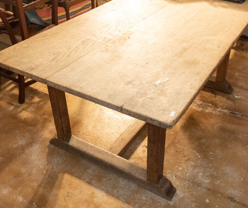 An oak large kitchen table, Arts and Crafts period, circa 1900, the attractively water washed pale