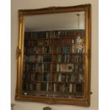 A large  modern mirror with bevelled rectangular plate and gilt “picture” frame, 132cm by 107cm