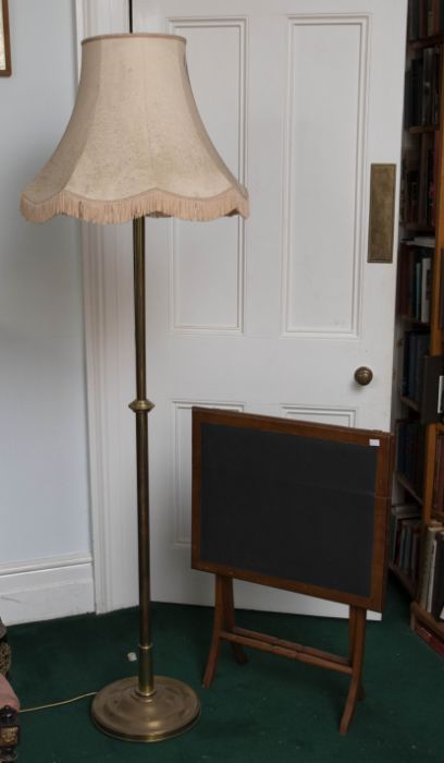 A brass plain standard lamp with disc shape weighted base: a folding card table. (2)