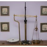 A decorative large cast iron and brass balance scales, J White and Son, Makers, Auchtermuchty, with