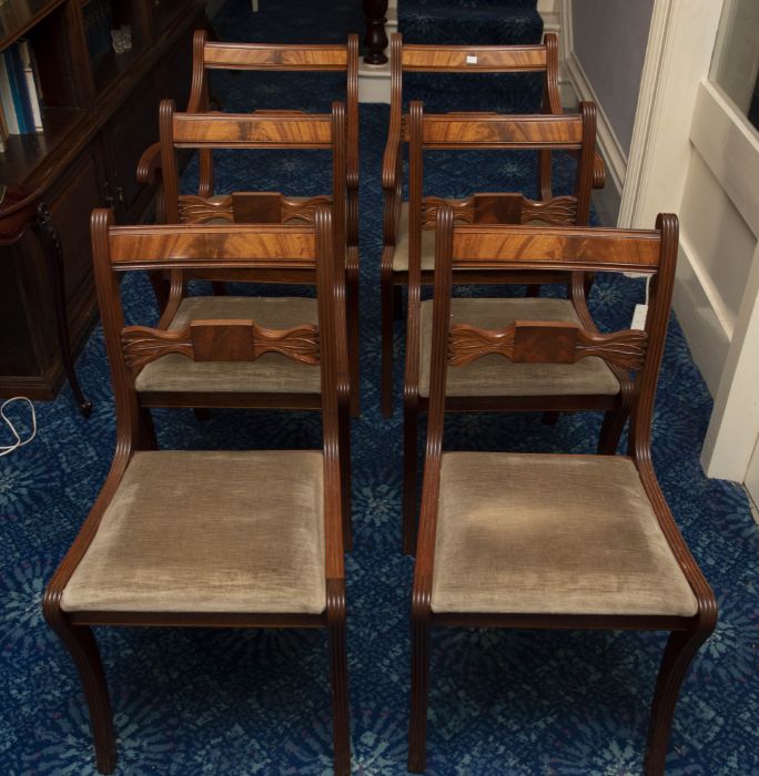 A set of six mahogany dining chairs in Regency style including two carvers