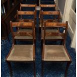 A set of six mahogany dining chairs in Regency style including two carvers