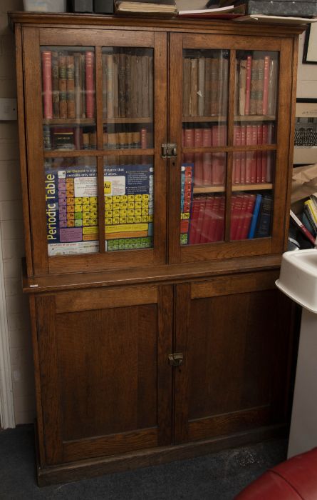 An early 20th century oak glazed office bookcase, 186cm high, 116cm wide.
