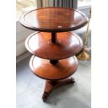 A William IV mahogany patent-action three tier dumb waiter, the circular tiers flattening into one,