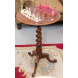 A late Victorian walnut and inlaid tripod games table, on barley twist stem, 46cm diameter, and a